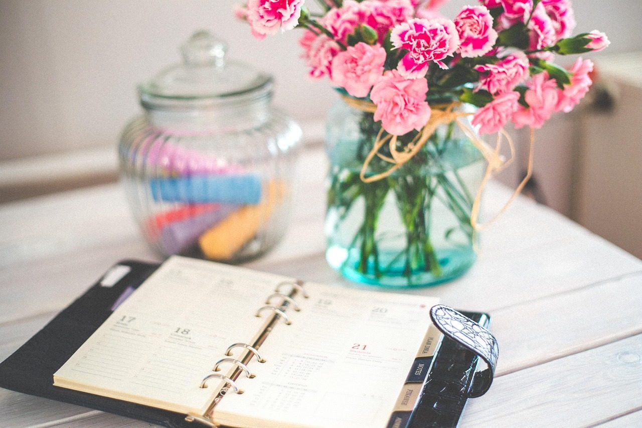 An open appointment planner on a desk