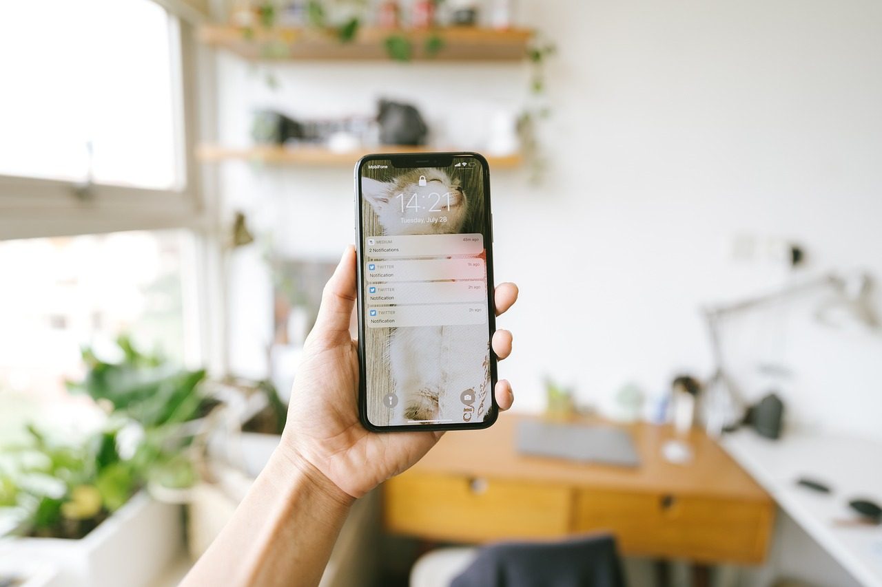 A smartphone showing a stack of message notifications in one place